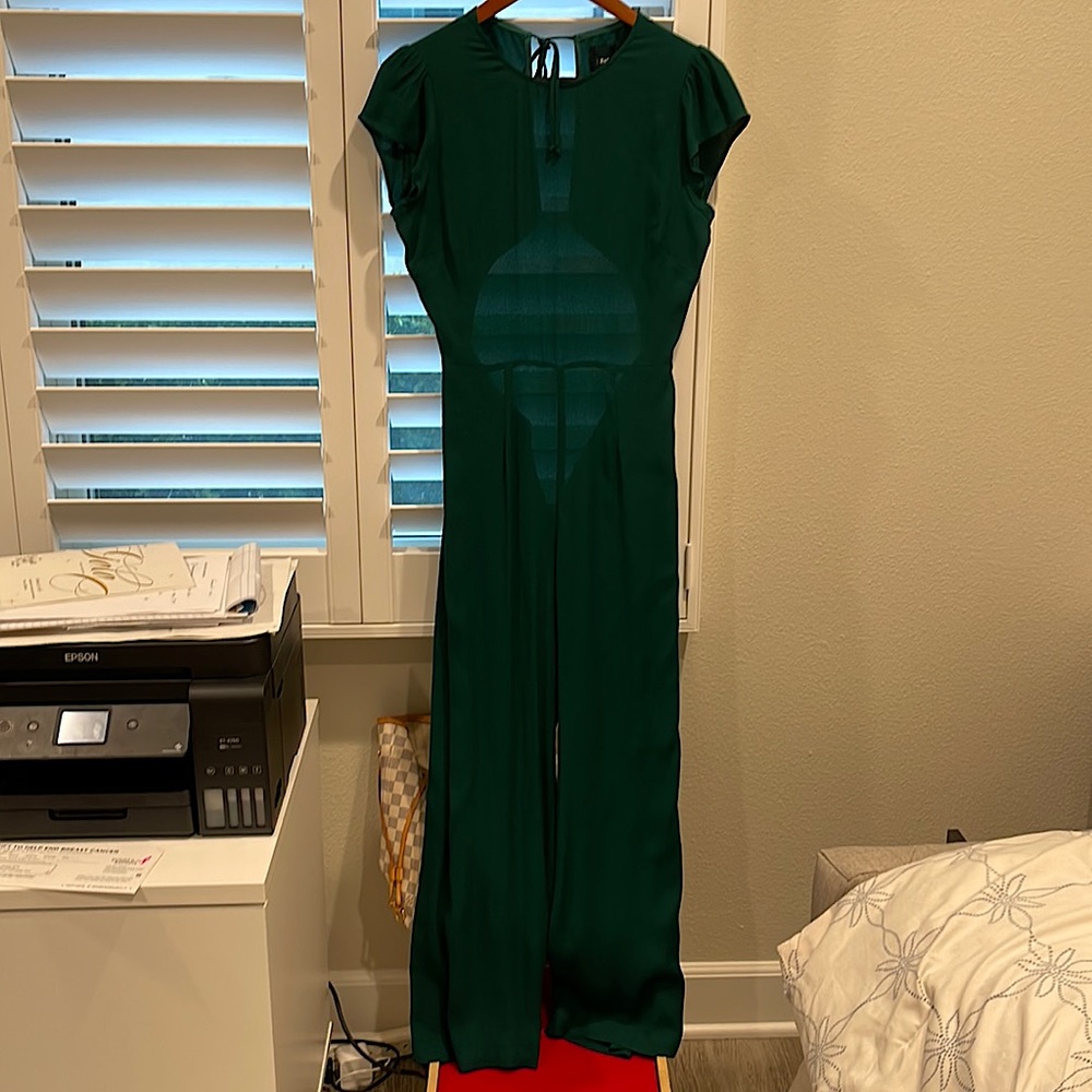 A green backless jumpsuit